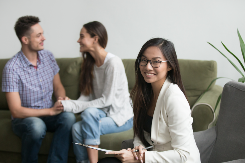 what is a certified financial planner? The couple pictured is meeting with their CFP® and getting a better take on their financial future.