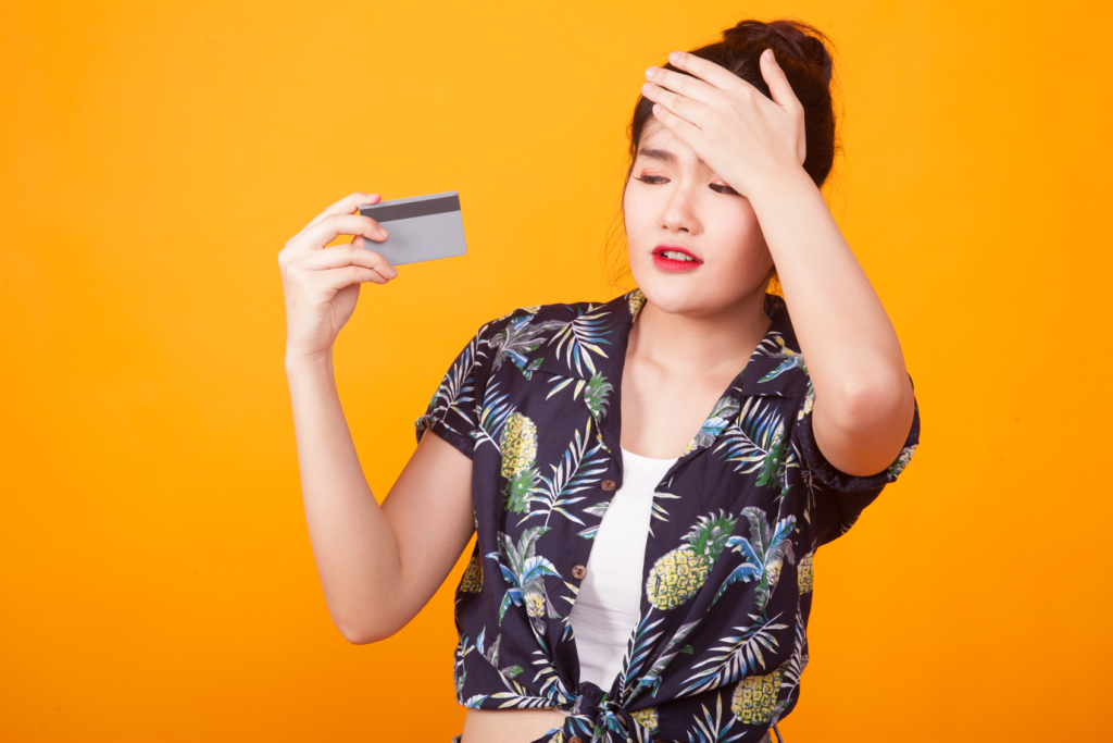 Woman struggling with a credit card interest rate that is very high.