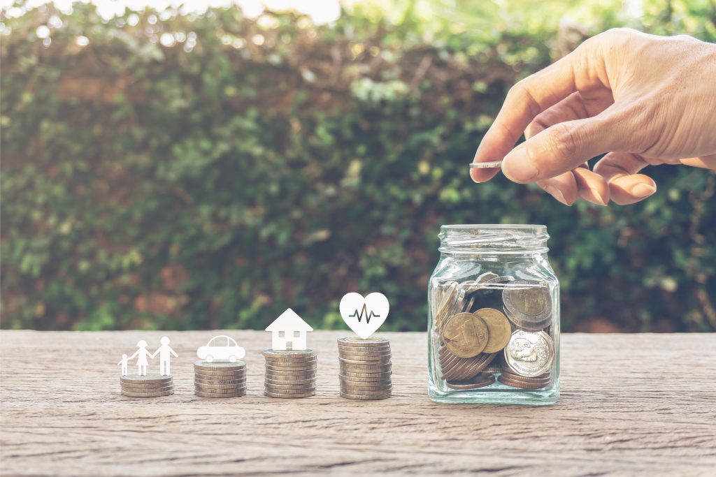 Abstract image of growing financial knowledge into financial capability. Money in increasingly large jars.