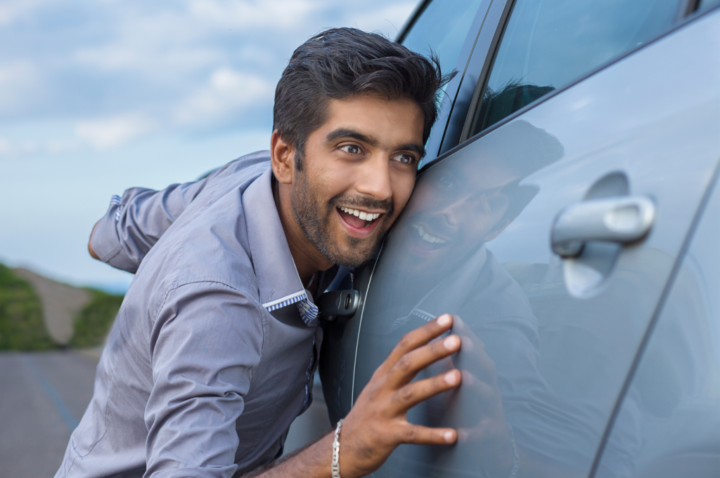 Excited car owner who benefited from our car buying tips to score a new ride he loves.