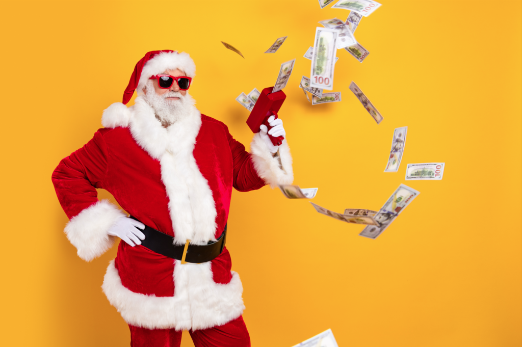 Santa Clause being very loose with his holiday spending. He is holding a toy money blaster and making it rain.