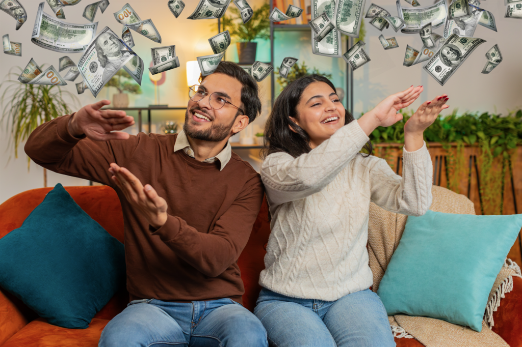 Newlyweds who succeeded at their financial planning for couples and are making it rain dollar bills.